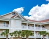 tan apartment complex and blue sky in background, pet friendly vacation home for rent in myrtle beach